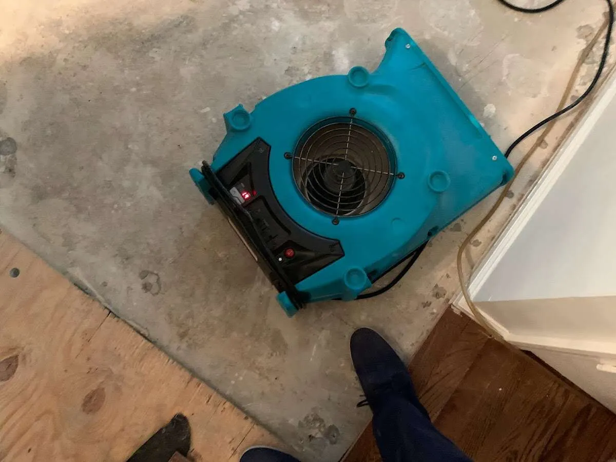 Air mover drying subfloor during Leak Detection & Repair in Southborough